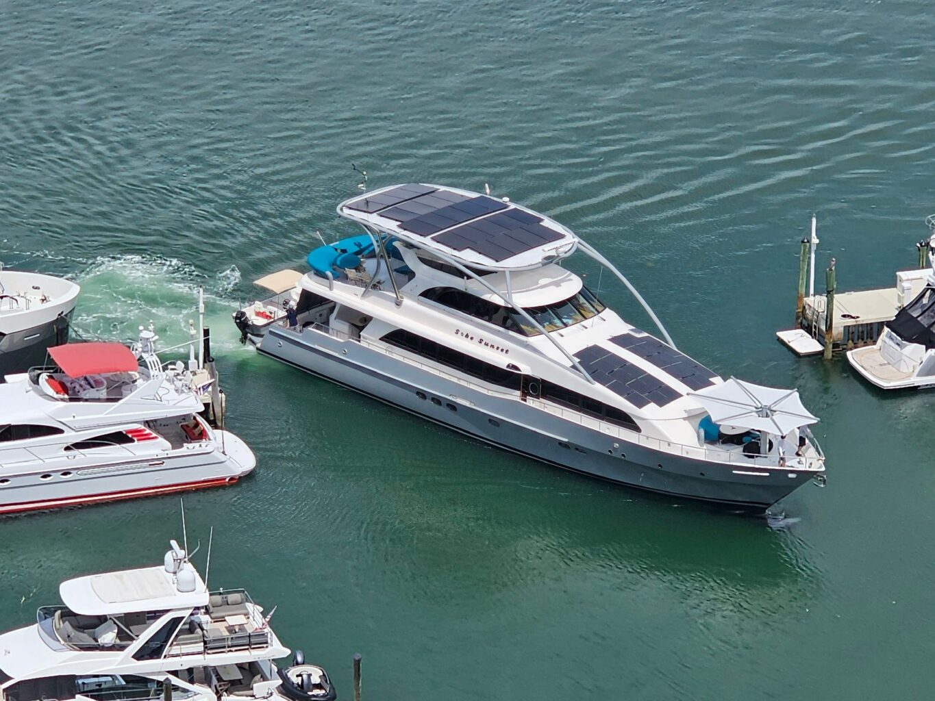 Aerial view of recreational boat equipped with solar panels and bidirectional dc dc converters from epic power